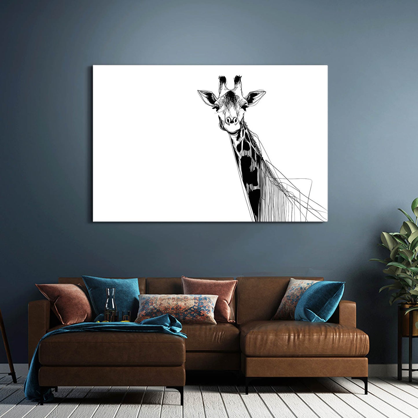 Giraffe artwork on a wall above a brown sofa with colorful cushions.