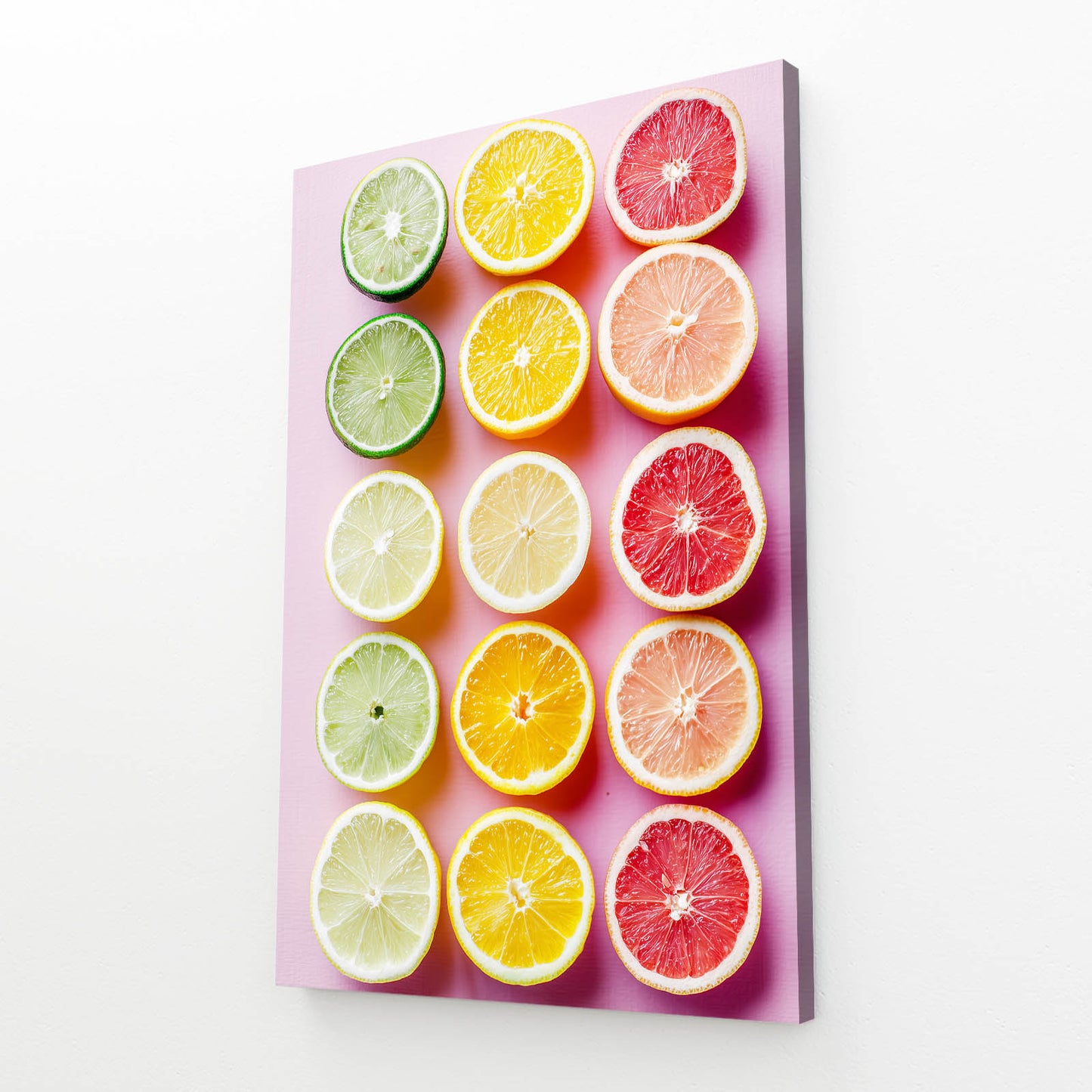 Citrus Rows Pastel Fruit Wall Decor – angled canvas view on white background
