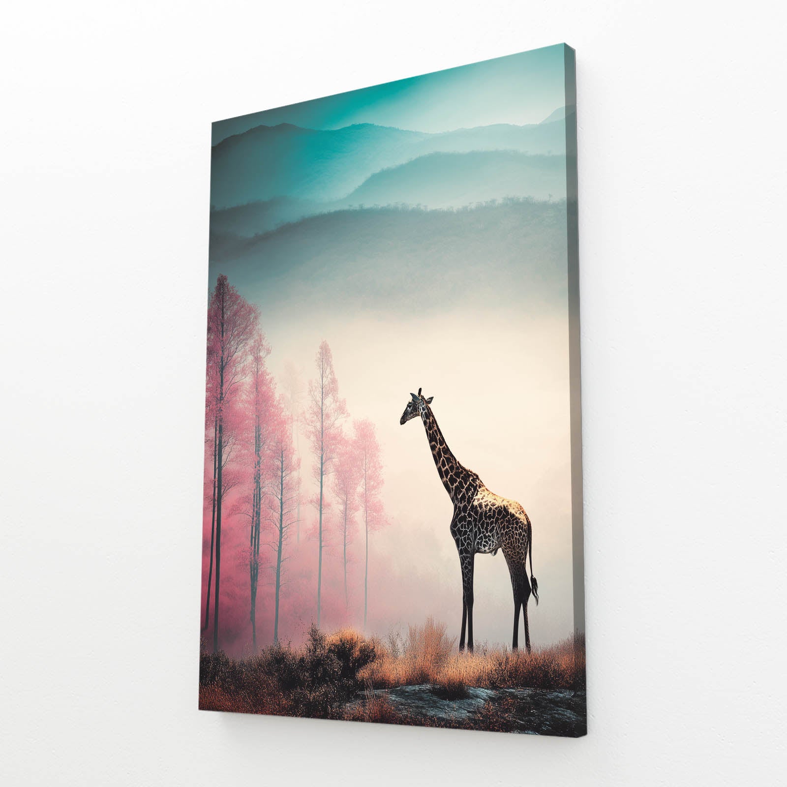 Giraffe standing in a scenic landscape with trees and mountains on a canvas print.