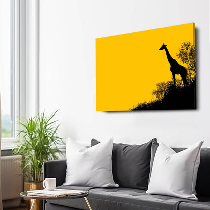 Yellow wall art with a black silhouette of a giraffe on a white wall above a gray sofa.