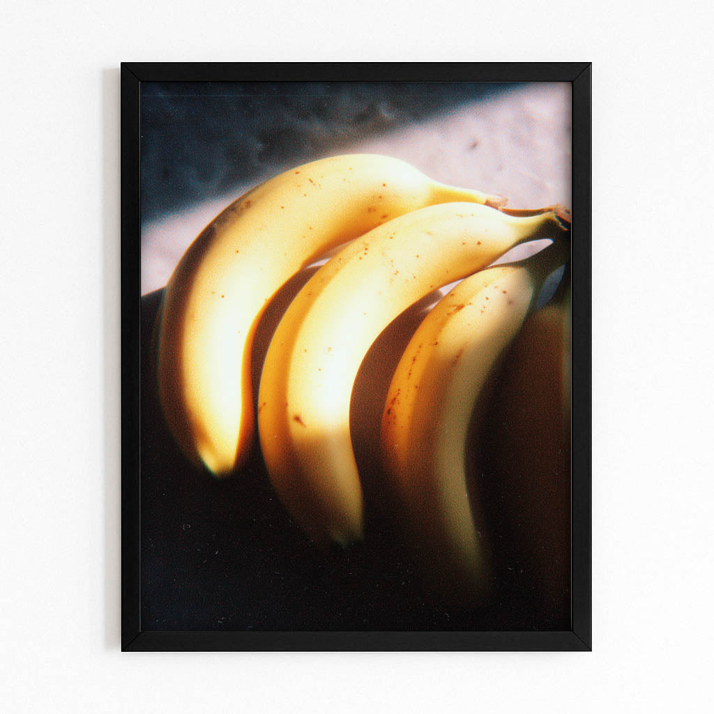 Golden Banana Glow Fruit Wall Art – with Premium Black frame on white background