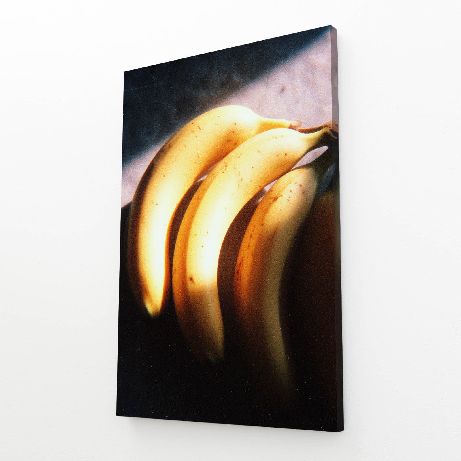 Golden Banana Glow Fruit Wall Art – angled canvas view on white background