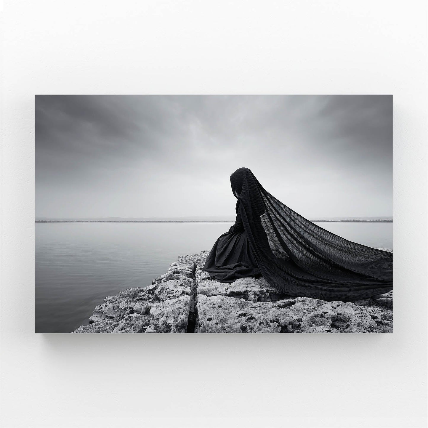 Grey Cloak Wall Art Photography – cloaked figure seated by still grey water