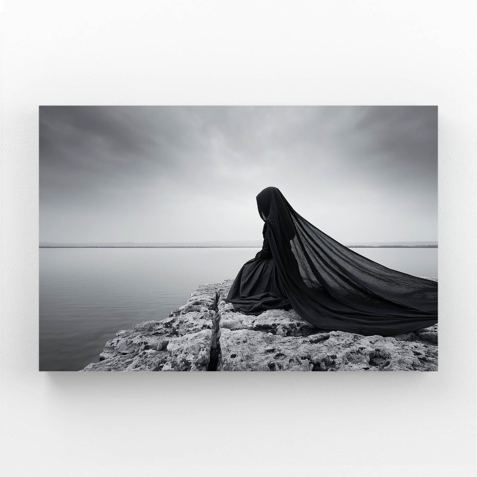 Grey Cloak Wall Art Photography – cloaked figure seated by still grey water