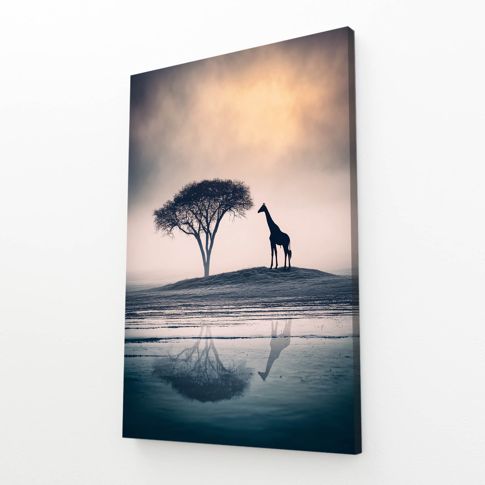 Giraffe silhouette next to a tree with reflection on water
