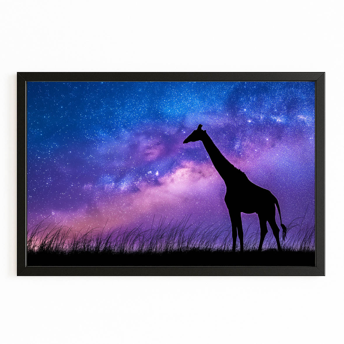 Silhouette of a giraffe against a starry night sky with the Milky Way galaxy.