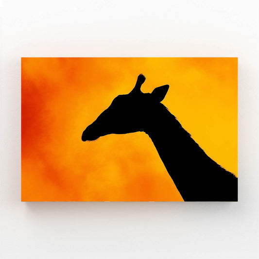 Silhouette of a giraffe against an orange background