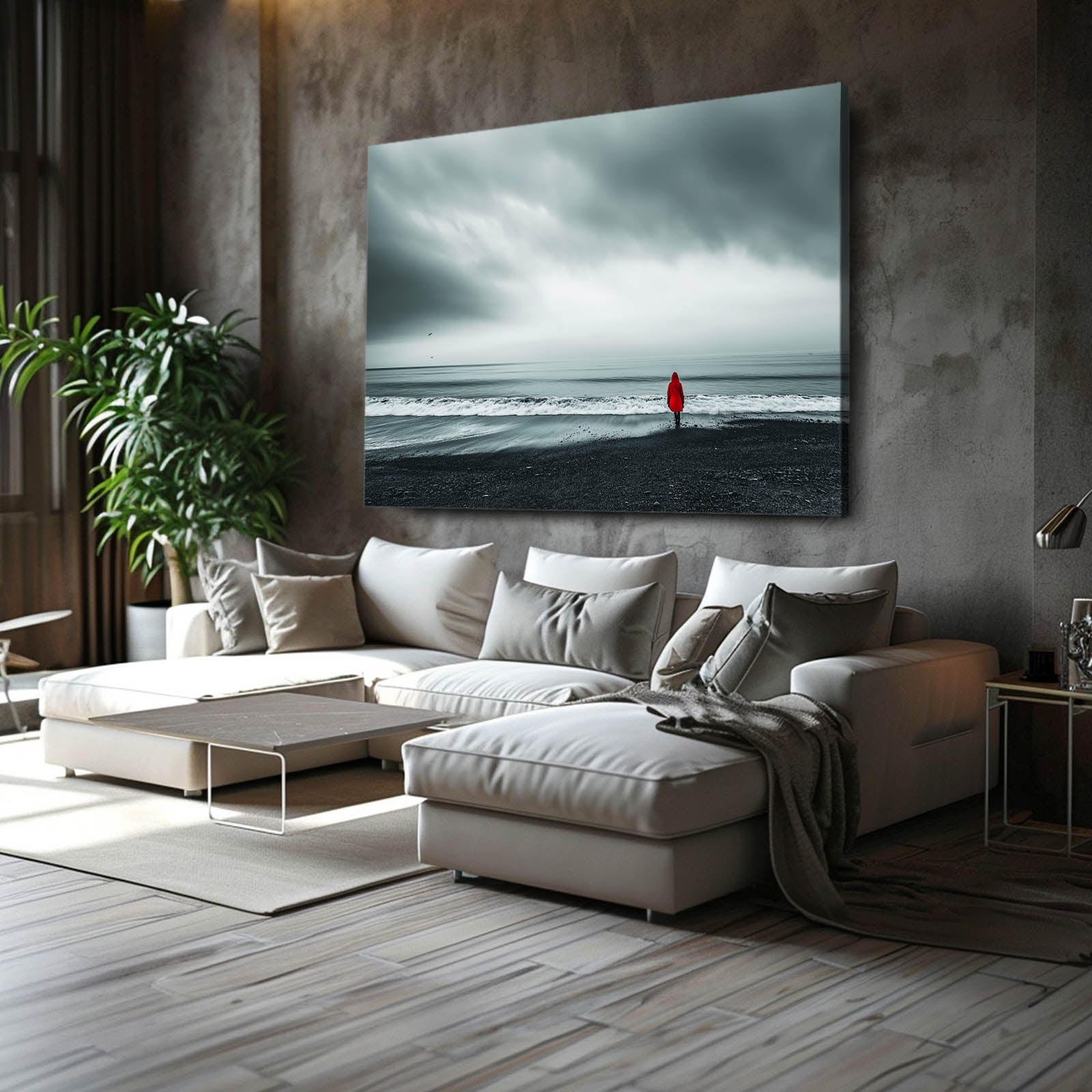 Red Coat Beach Photography Canvas – above a grey sectional in a concrete loft