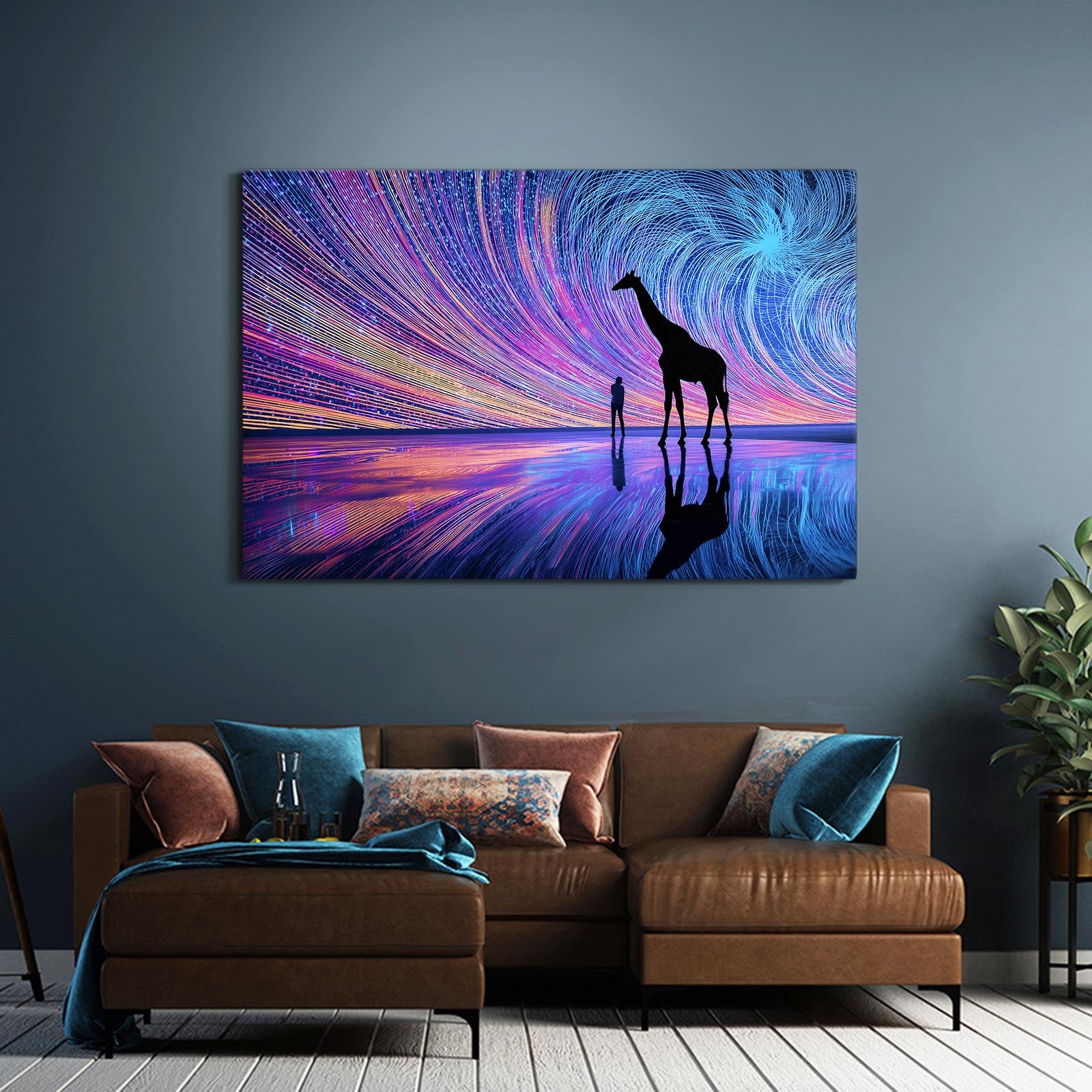 Framed artwork of a giraffe and person silhouette against a colorful starry night sky, hanging above a brown sofa.